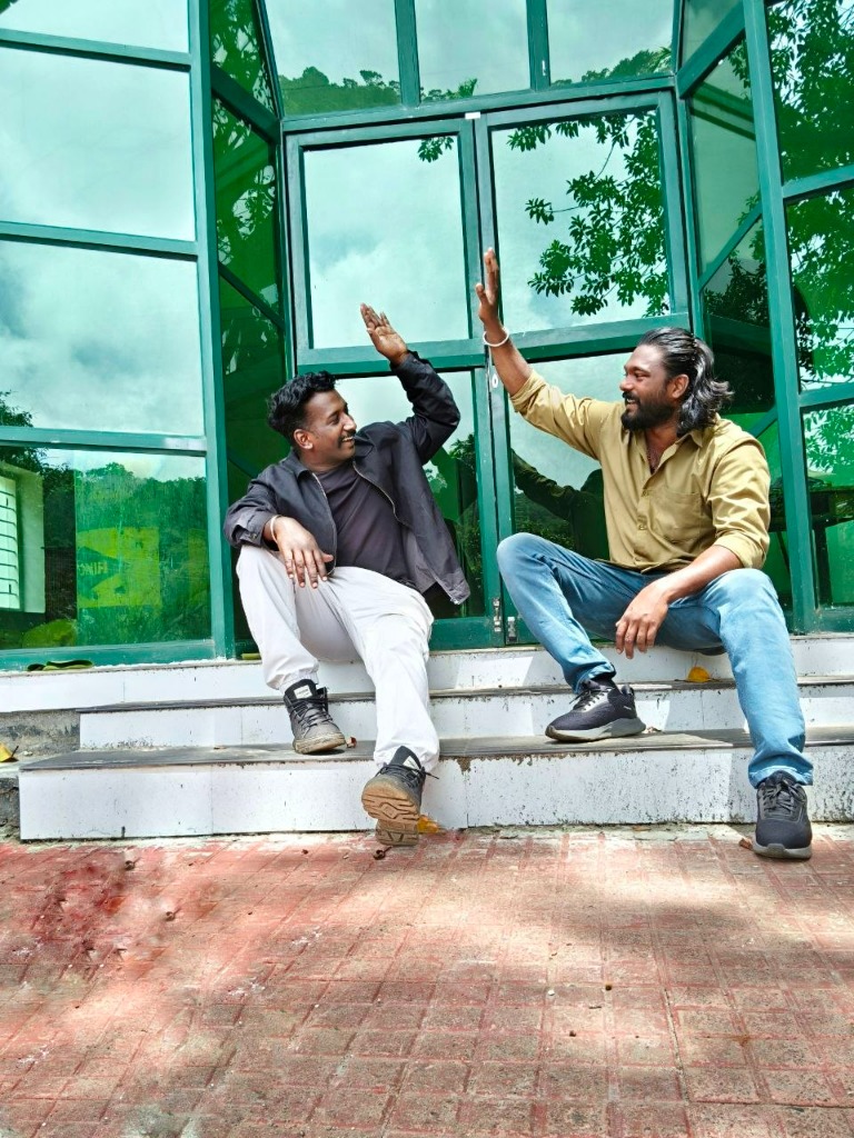 Friends high-fiving in celebration of Gavi safari adventure